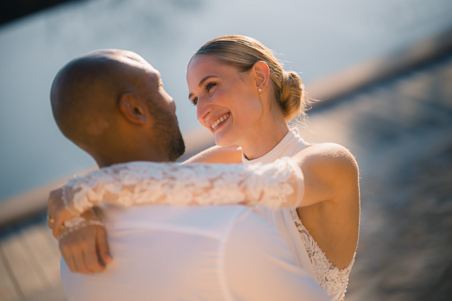 Bride and groom sharing a warm, unguarded moment together.