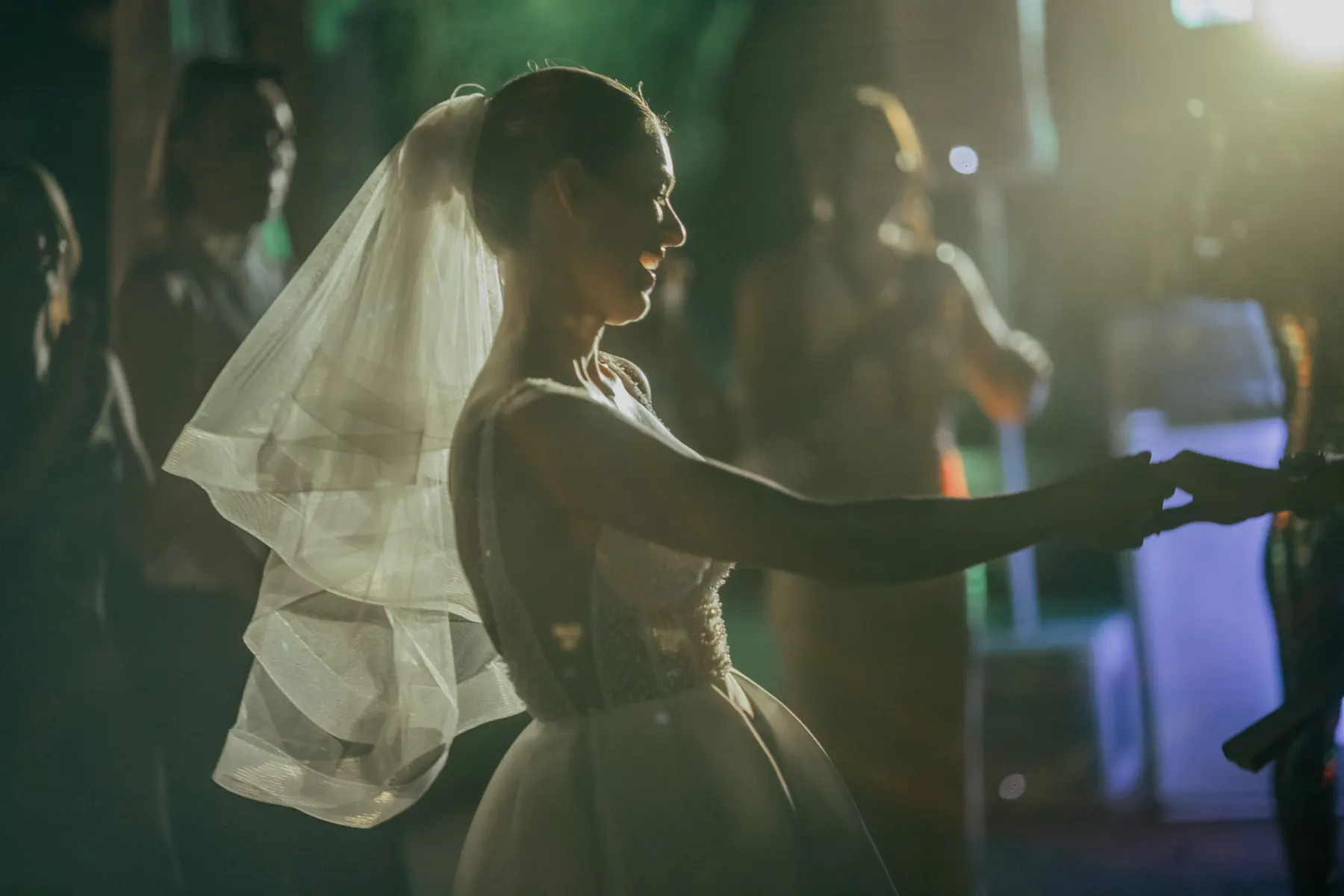 Bride dancing in evening light