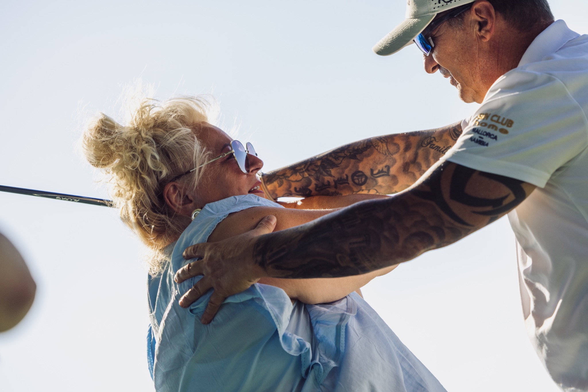 Two participants greeting each other warmly during the team-building day