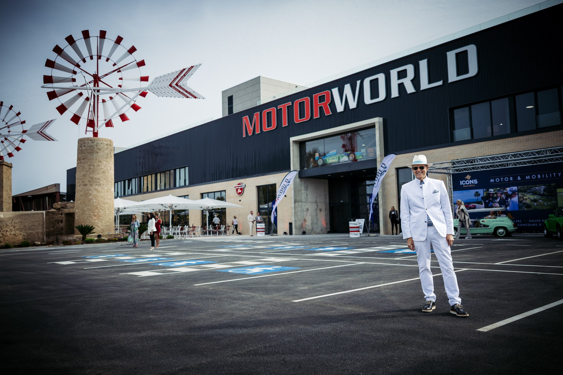 Man standing in front of the Motorworld Mallorca building.