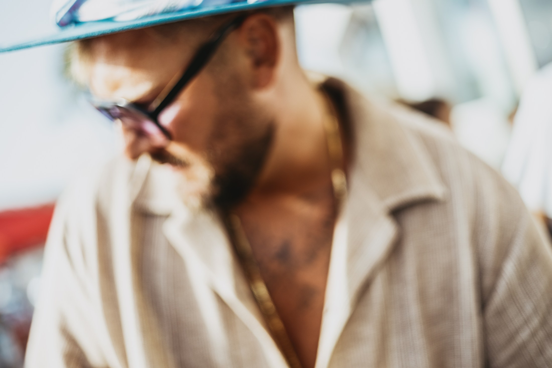 Close portrait of a bearded man wearing sunglasses.