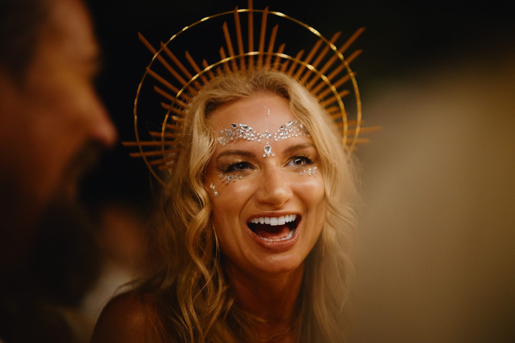Guest smiling during a lively evening celebration
