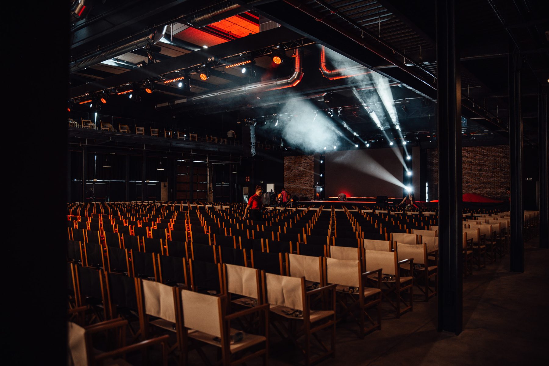 Prepared stage and rows of chairs before an event begins