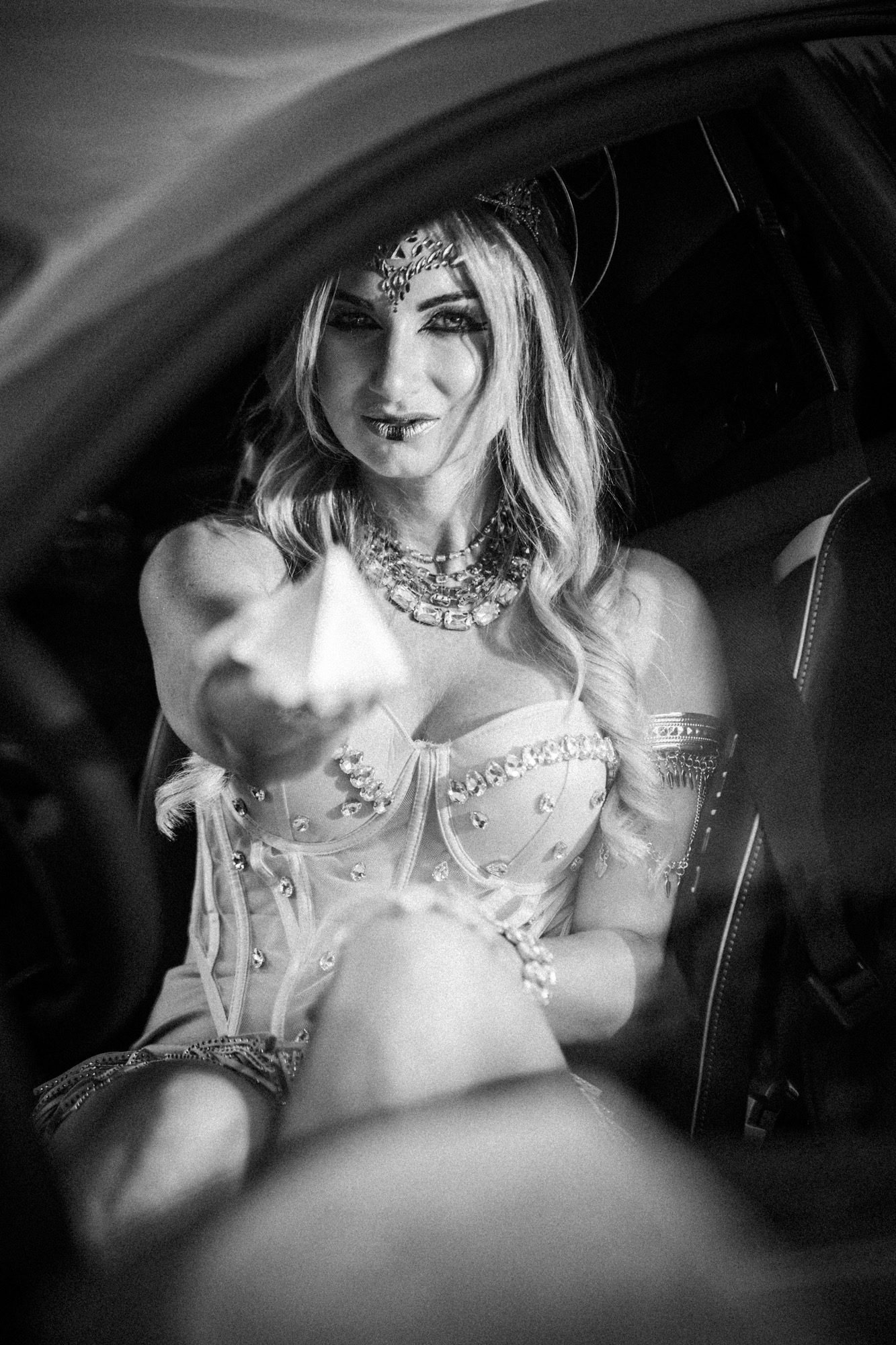 Black-and-white detail of a performer in costume.