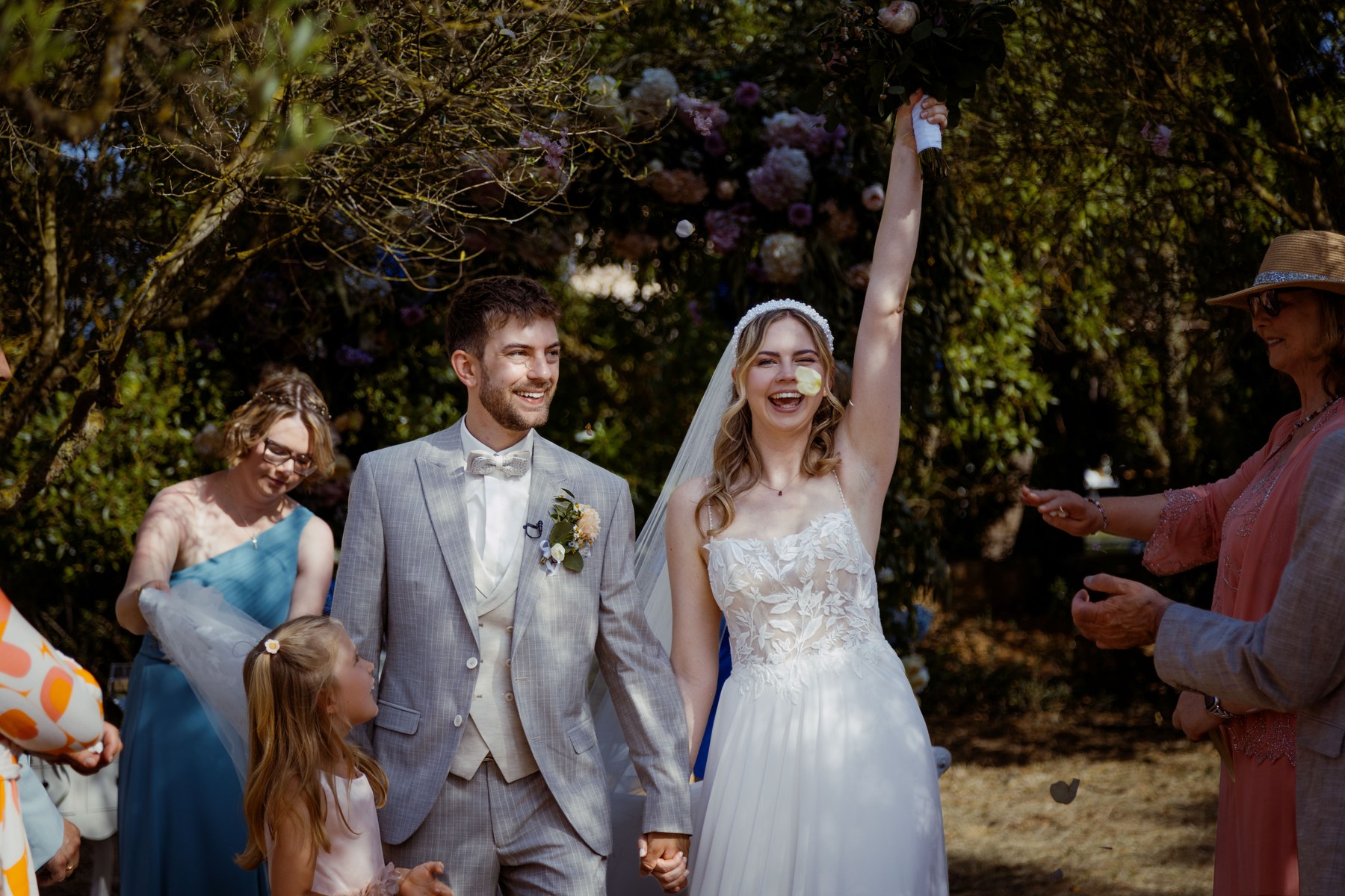 Annarina and Basti celebrating as they leave the ceremony.