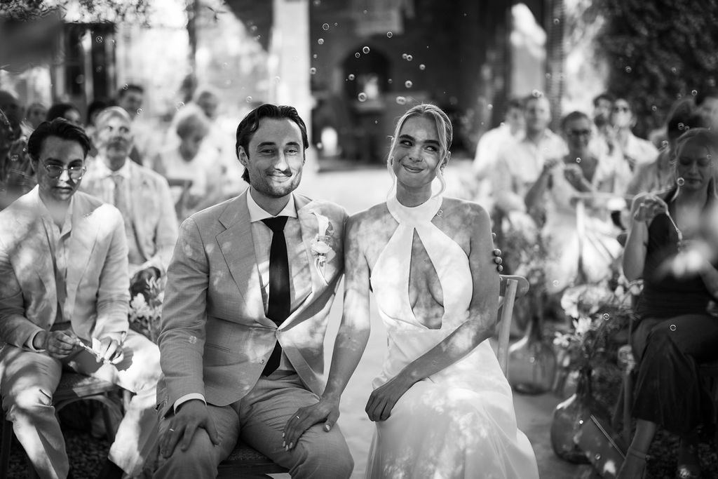 Isabelle and Arne seated together during the ceremony.