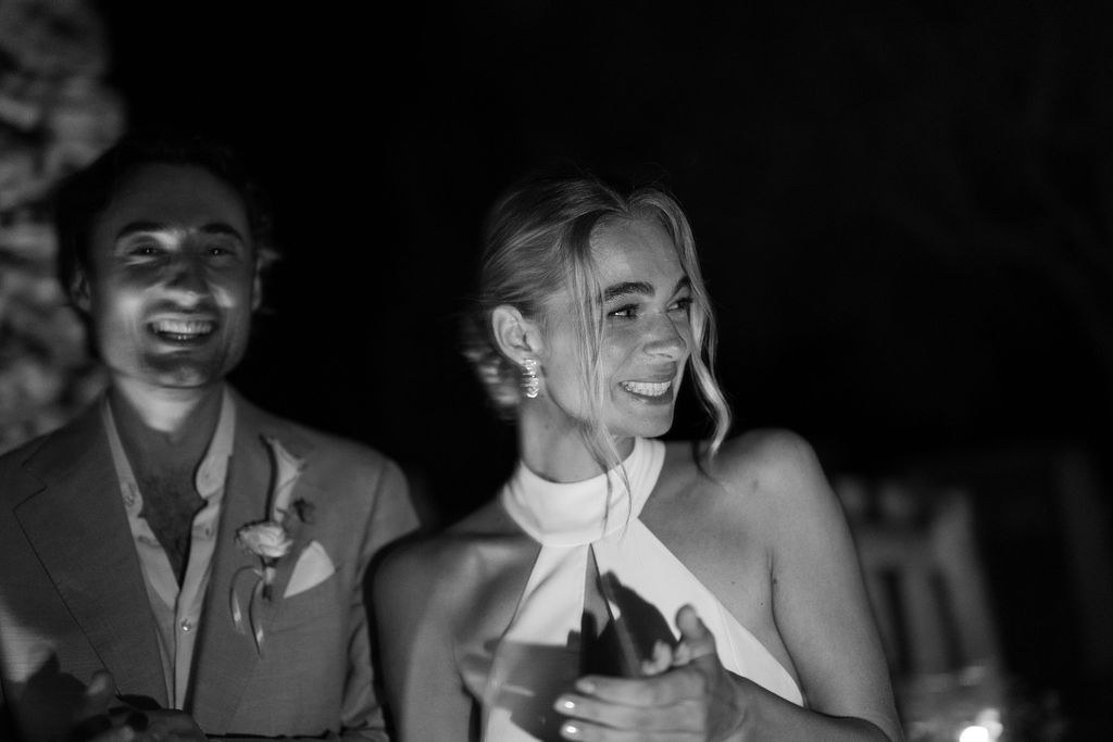 Isabelle and Arne laughing together at night.
